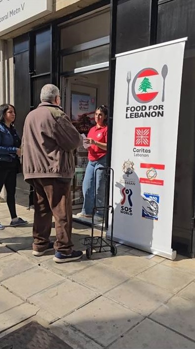 Description: A person standing next to a sign  AI-generated content may be incorrect.