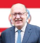 Description: A person in a suit and tie  AI-generated content may be incorrect.